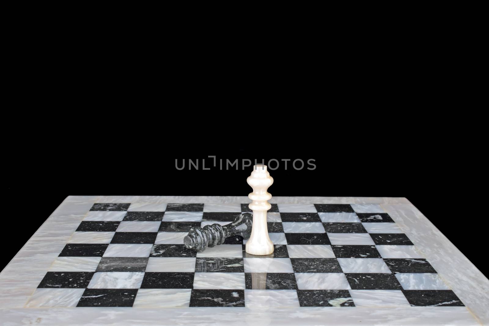 King beats the king, chessplay on a marble chess board