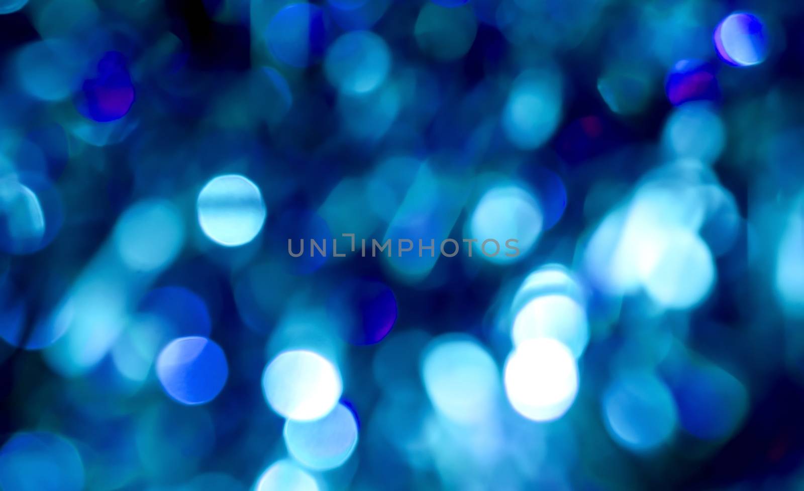 Blue circle christmas lights as blur background.