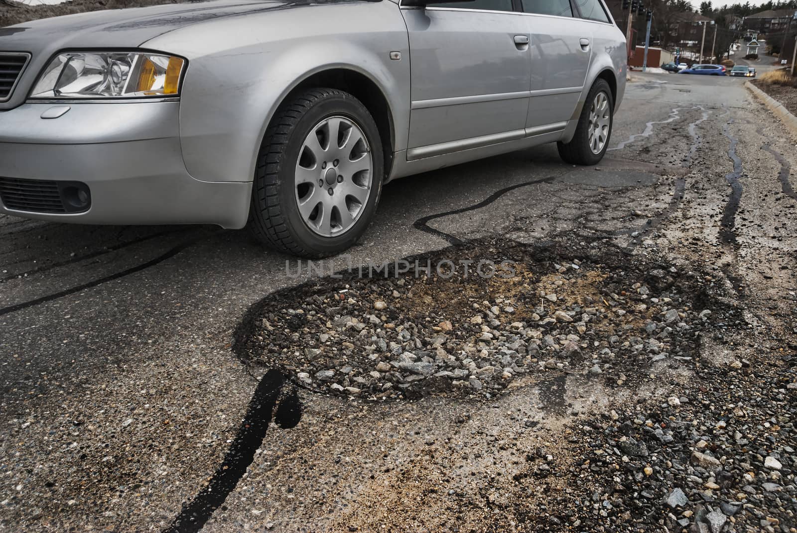 Big pothole in road by f/2sumicron