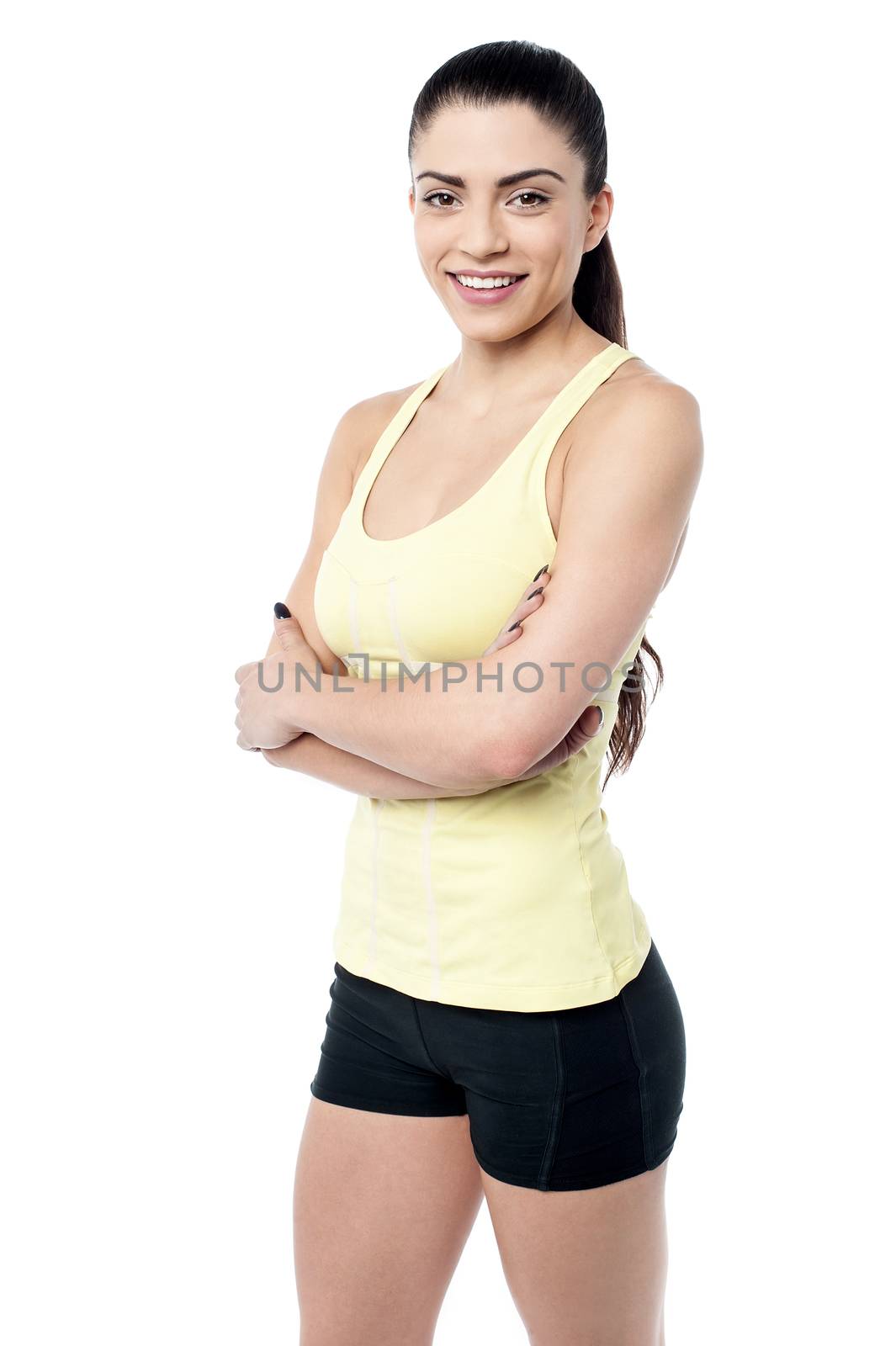 Fit young woman posing with hands on waist