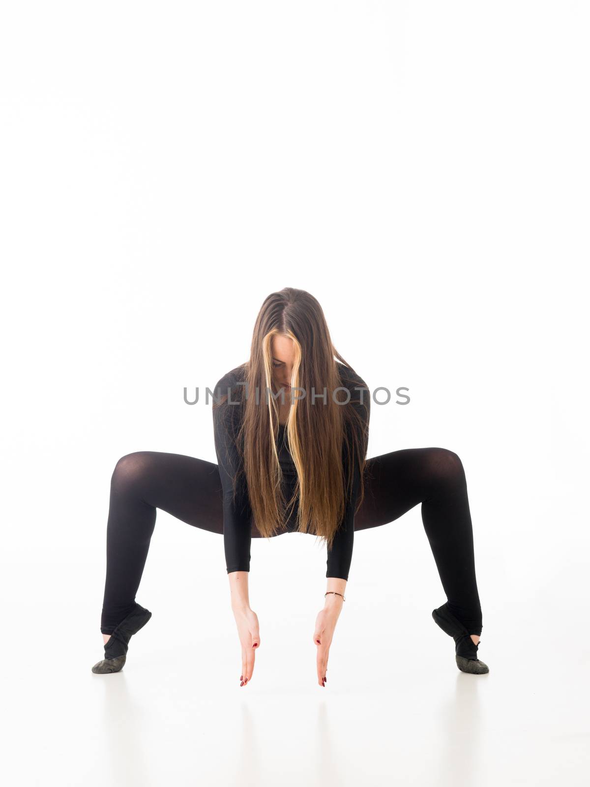 female dancer exercising dance choreography, on white background