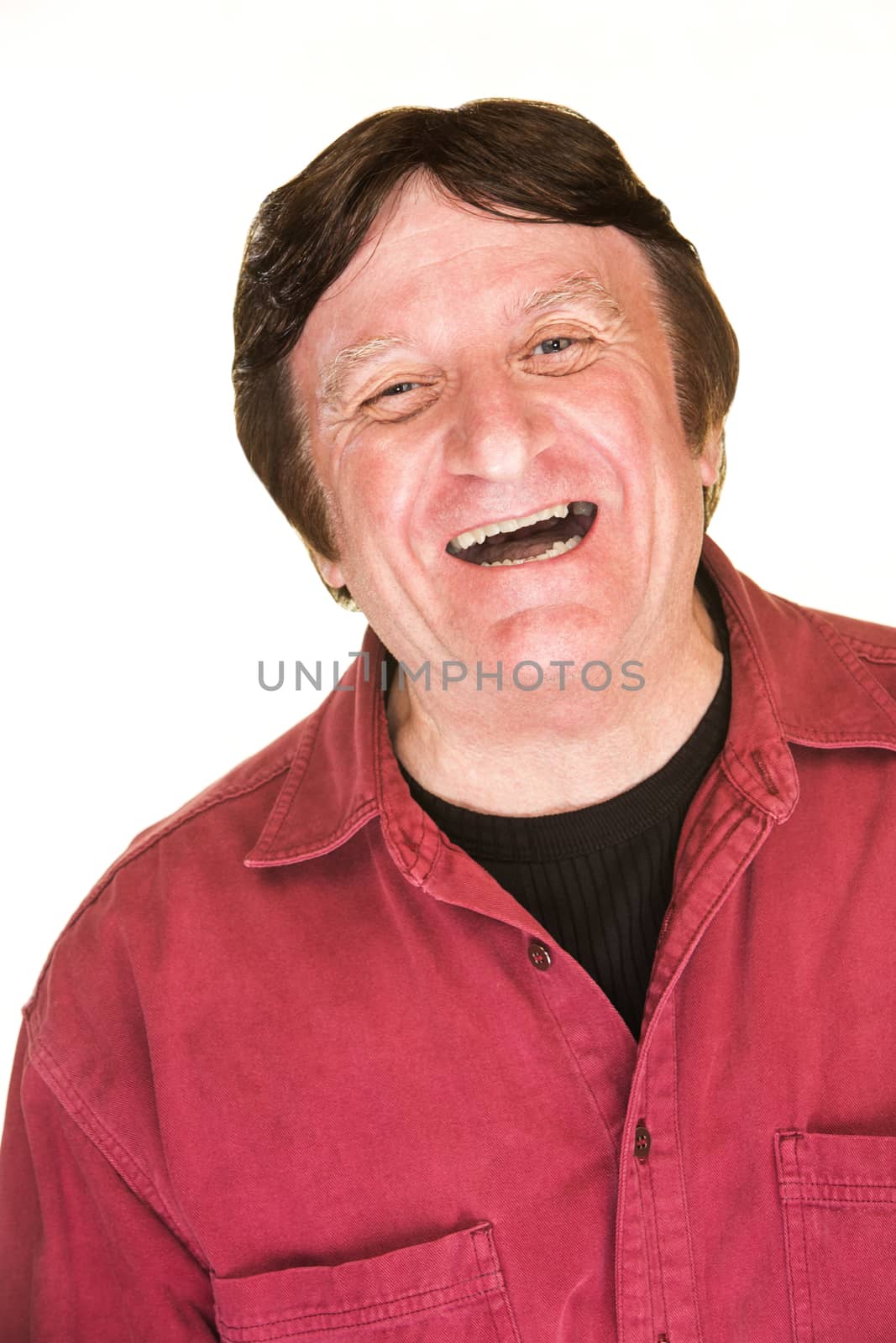 Laughing mature man over isolated white background