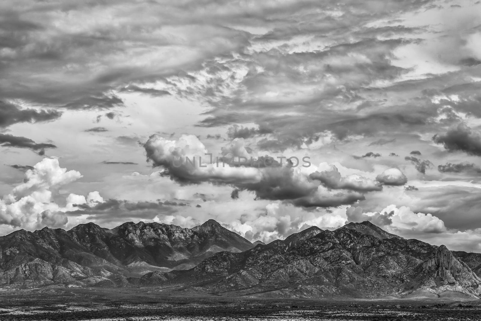 Monsoon clouds forming around arizona  mountain in summer