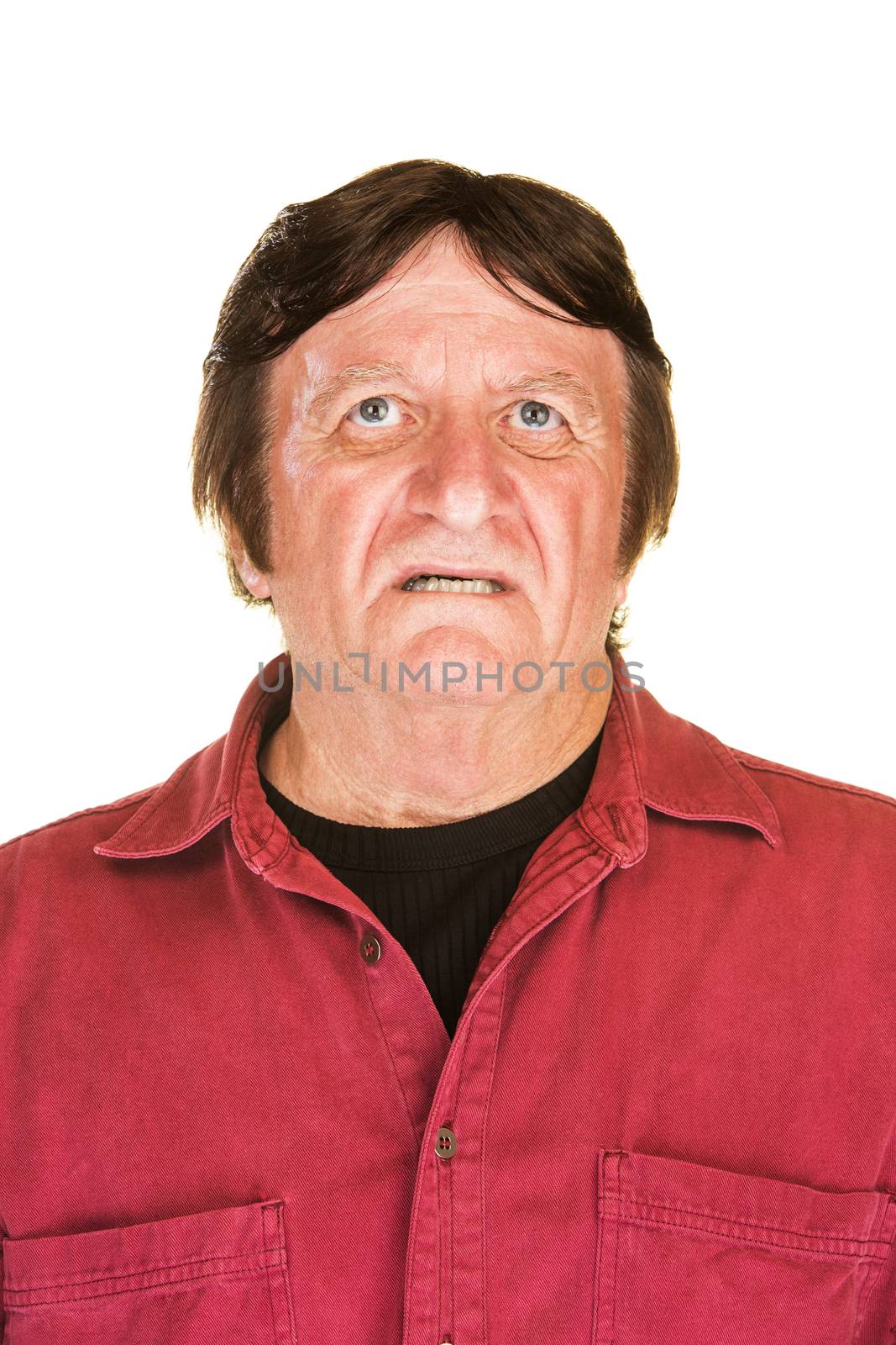Isolated worried middle aged man looking up