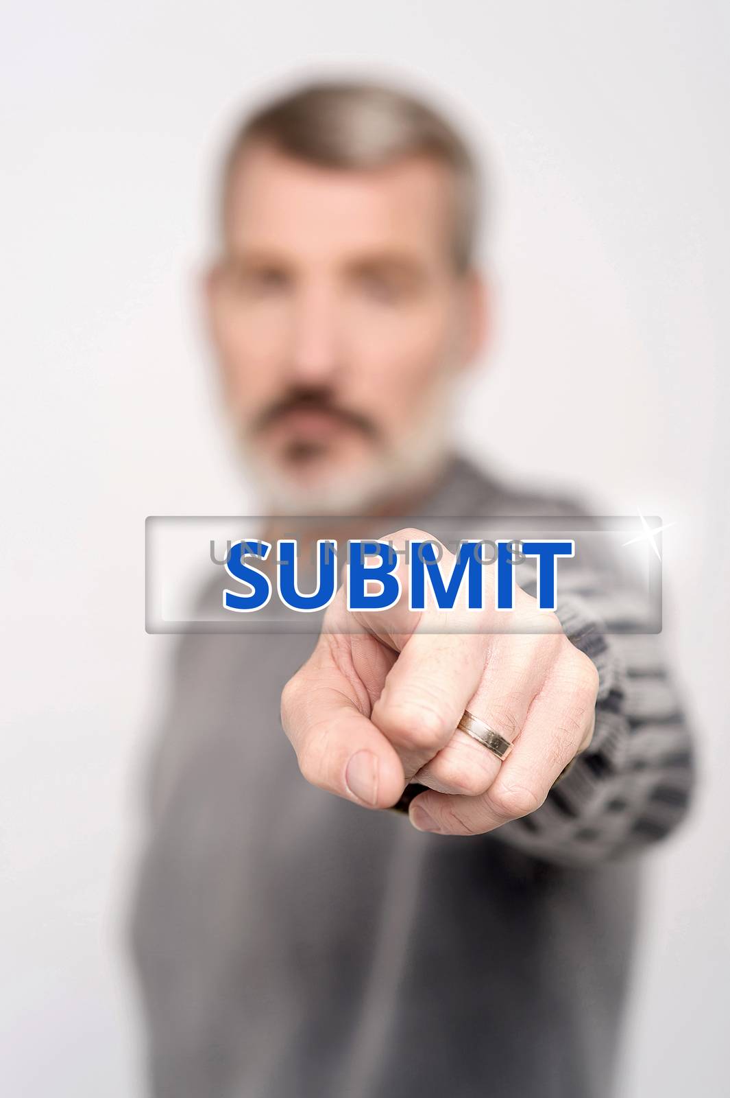 Man pressing submit button on digital interface