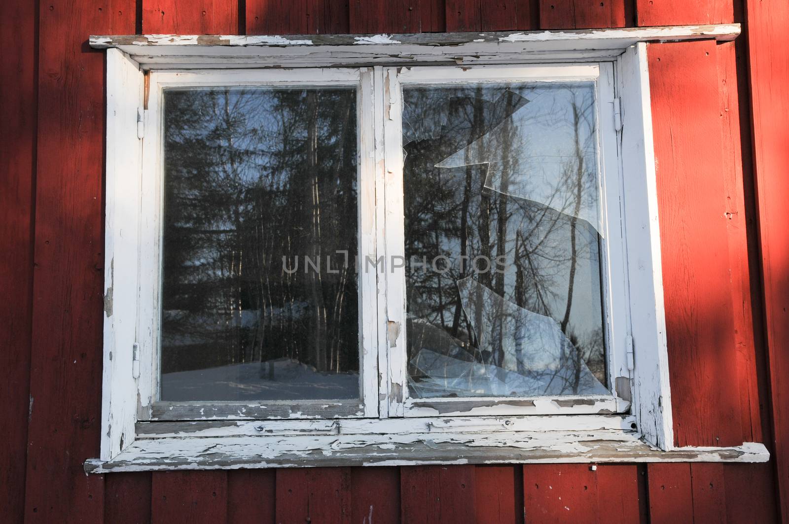 Broken window in an abandoned house