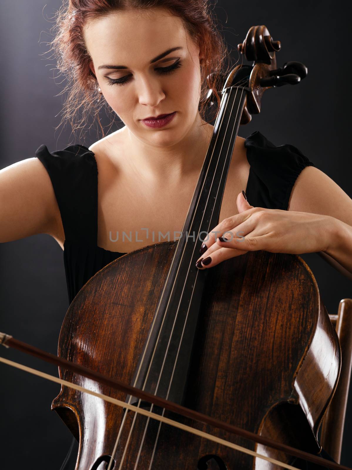 Closeup of a beautiful cellist by sumners