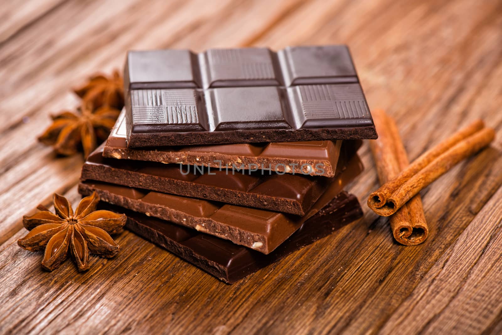 chocolate set, star anise and cinnamon sticks close up