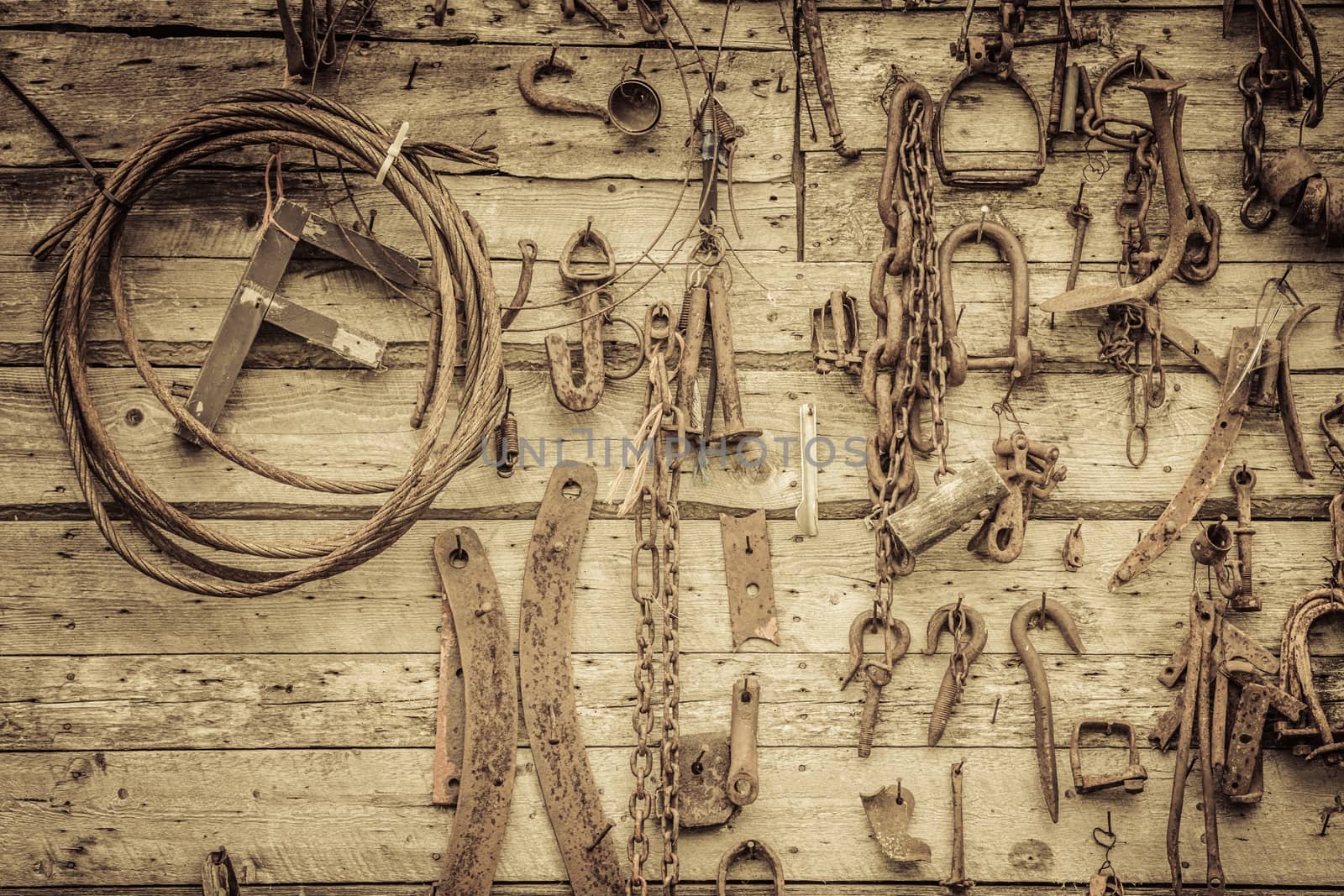 Wall Filled with Old Tools Hanging on the wall by aetb