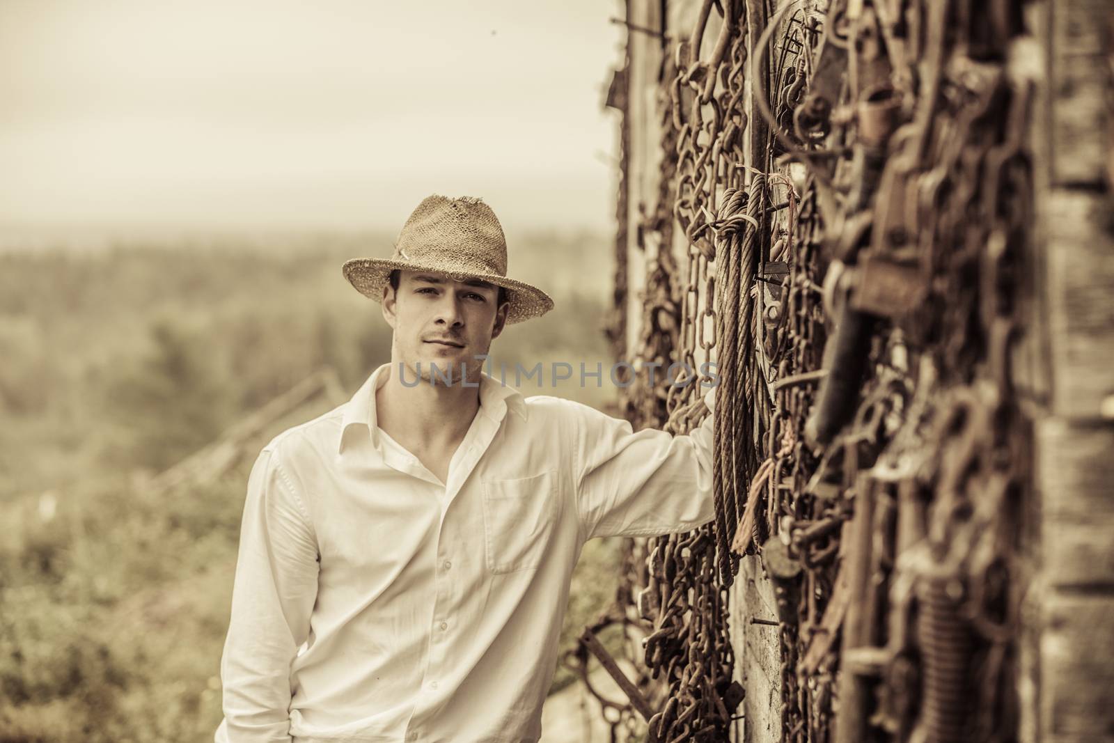 Farmer Portrait in front of a Wall Full of Tools by aetb