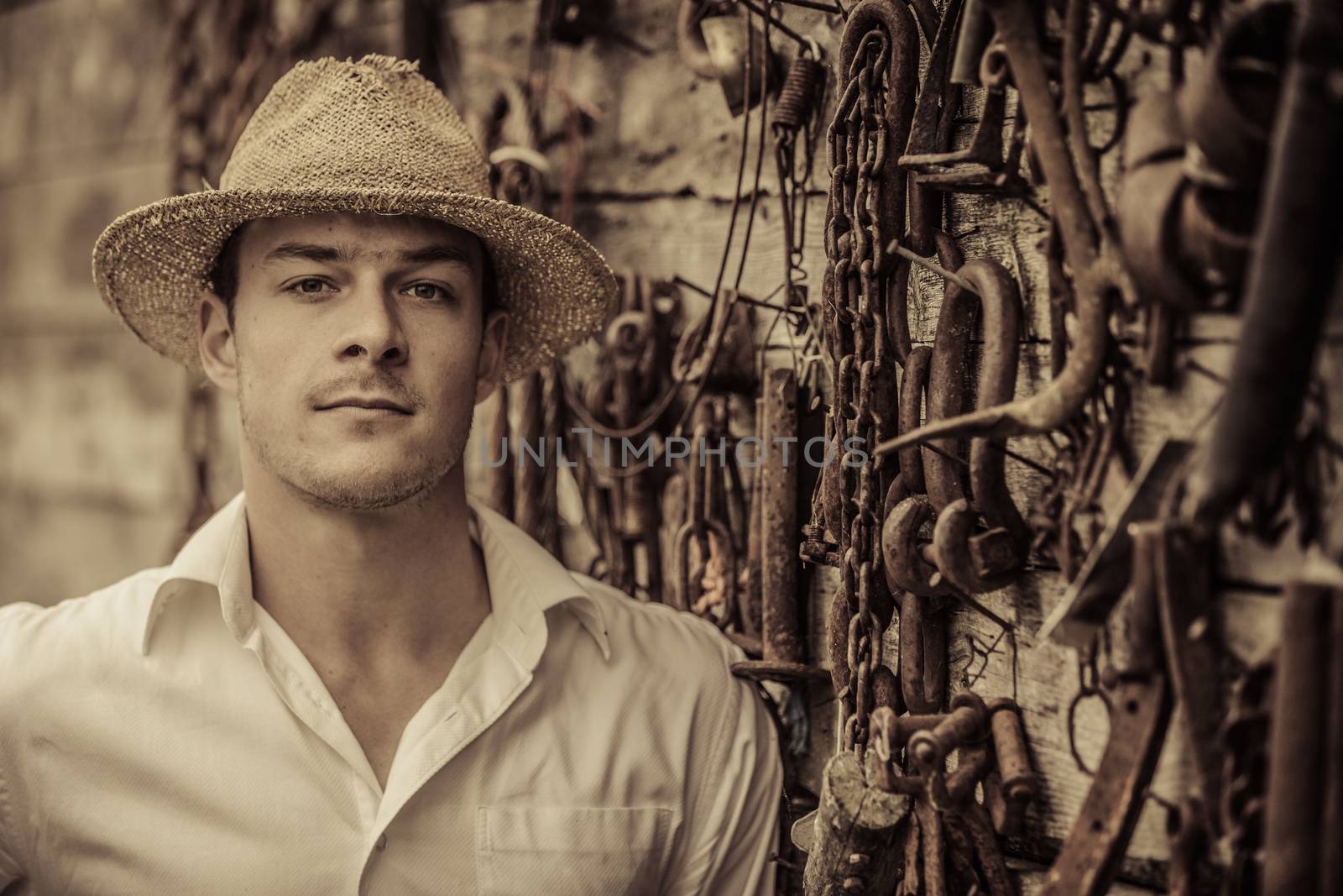 Farmer Portrait in front of a Wall Full of Tools by aetb