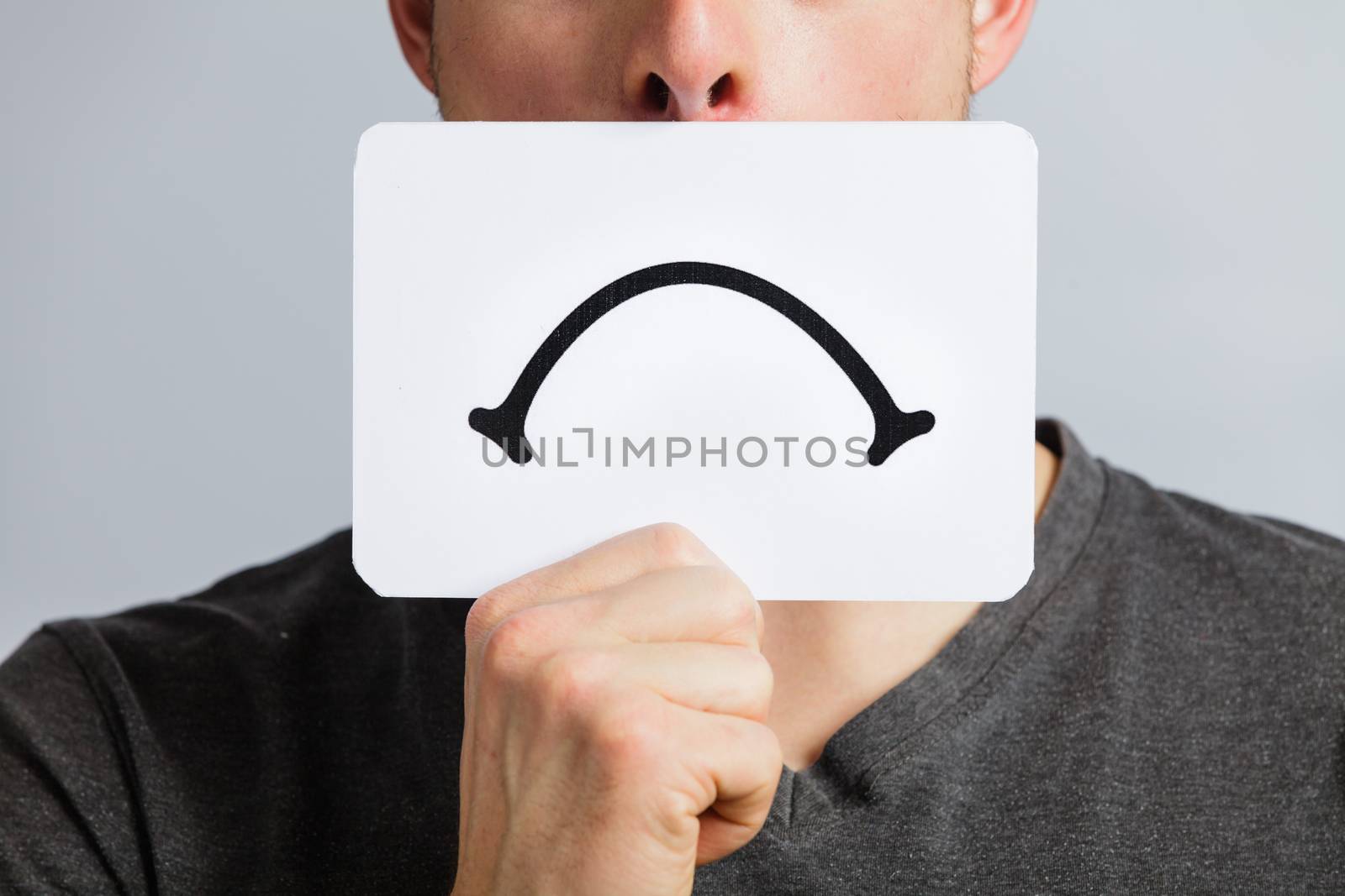 Unhappy Portrait of a Man Holding a Sad Mood Board