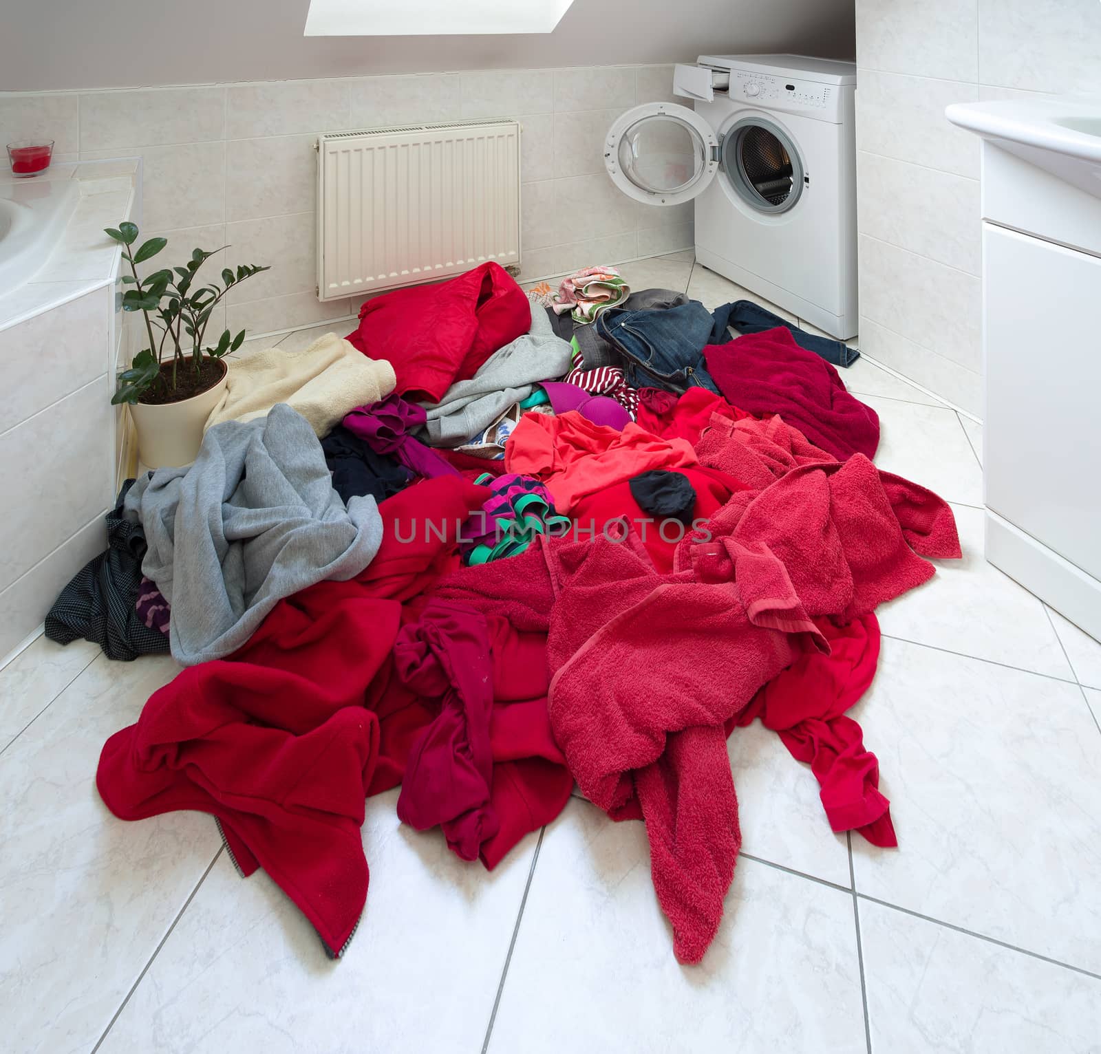 pile of dirty clothes ready for the wash in home bathroom