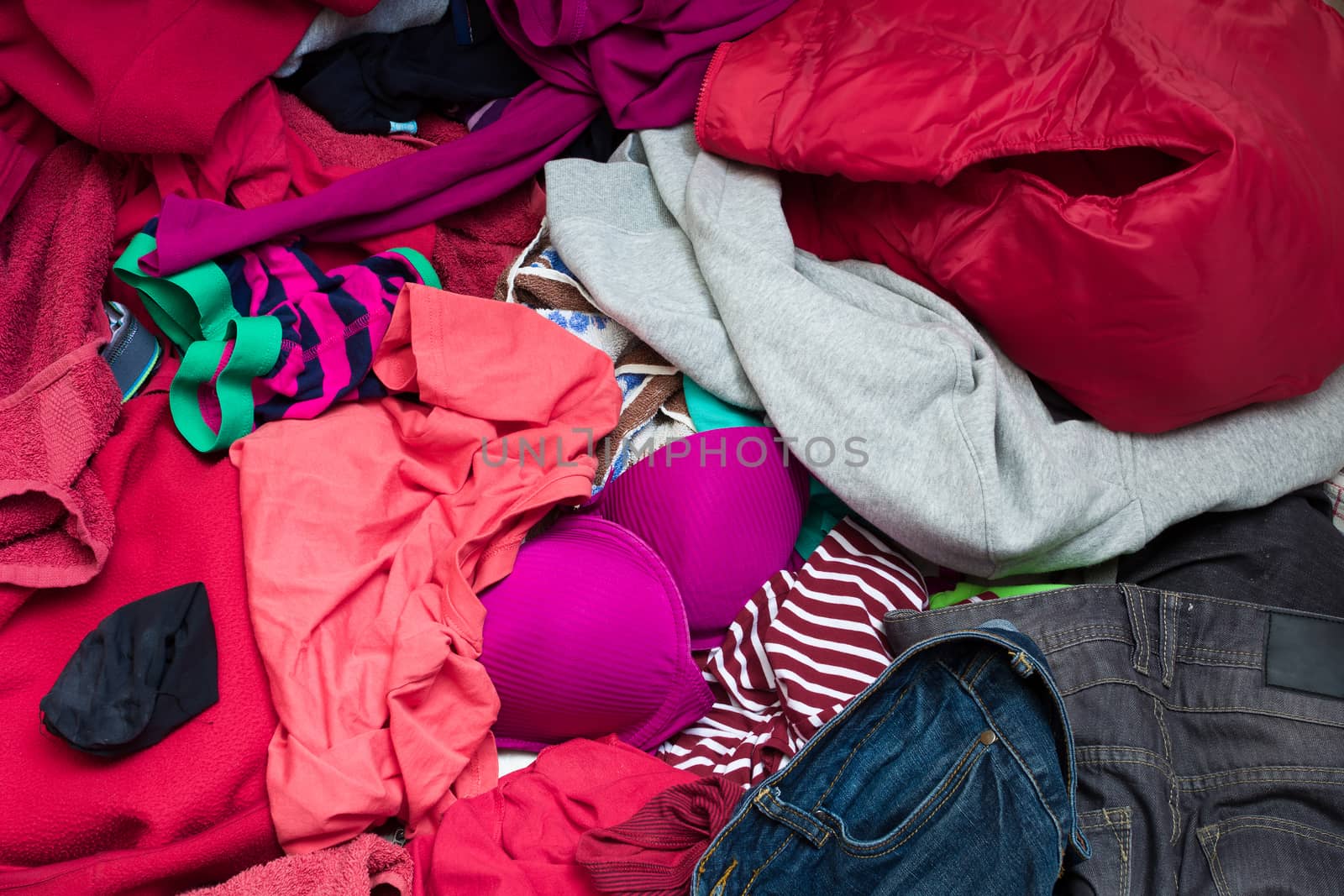 pile of dirty clothes ready for the wash in home bathroom