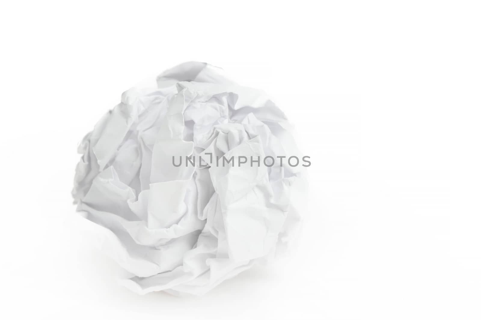 close-up of crumpled paper ball on white background