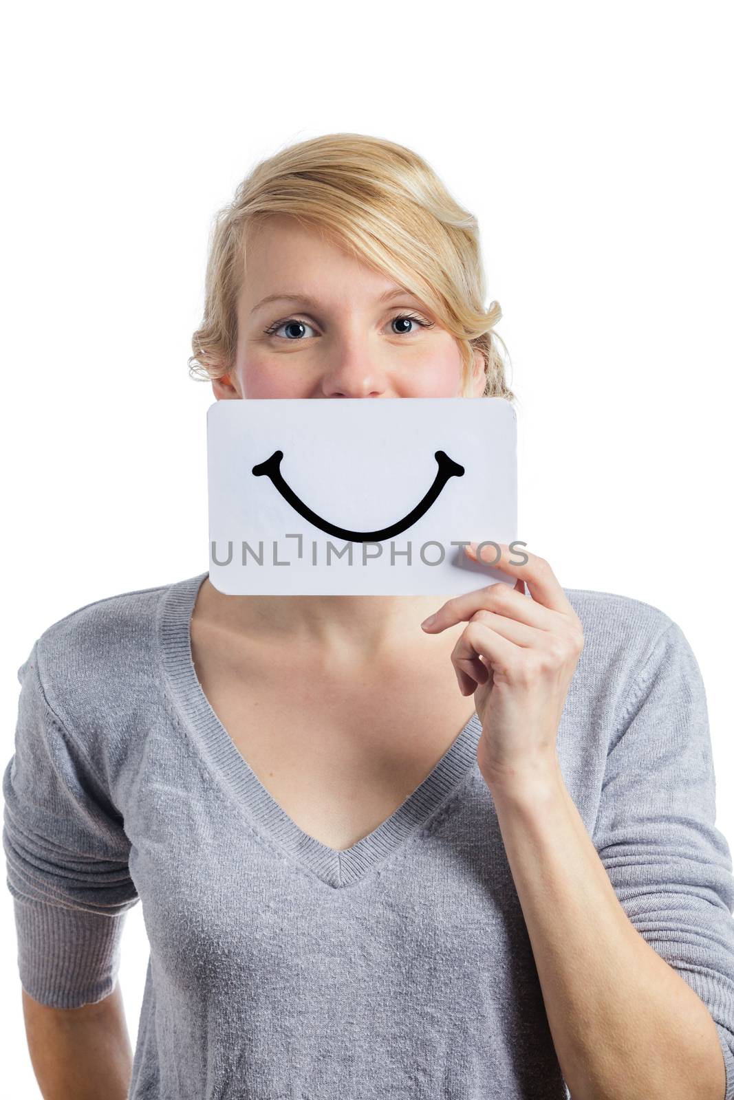 Happy Portrait of a Woman Holding a Smiling Mood Board Isolated on White Background