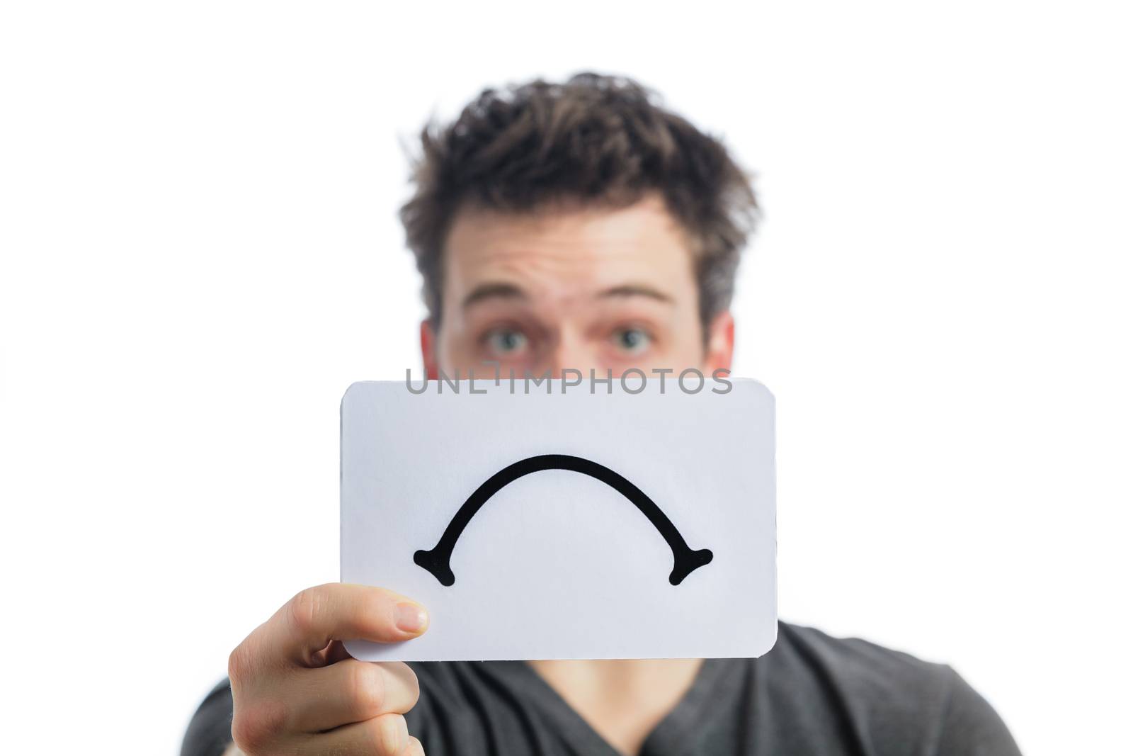 Unhappy Portrait of a Man Holding a Sad Mood Board Isolated on White Background