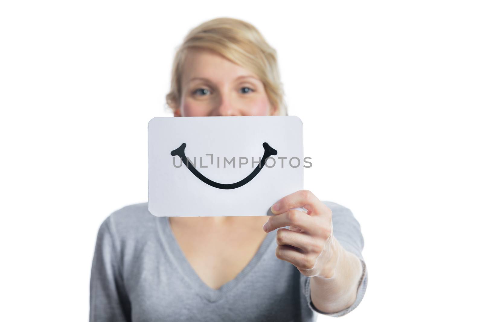 Happy Portrait of a Woman Holding a Smiling Mood Board Isolated on White Background