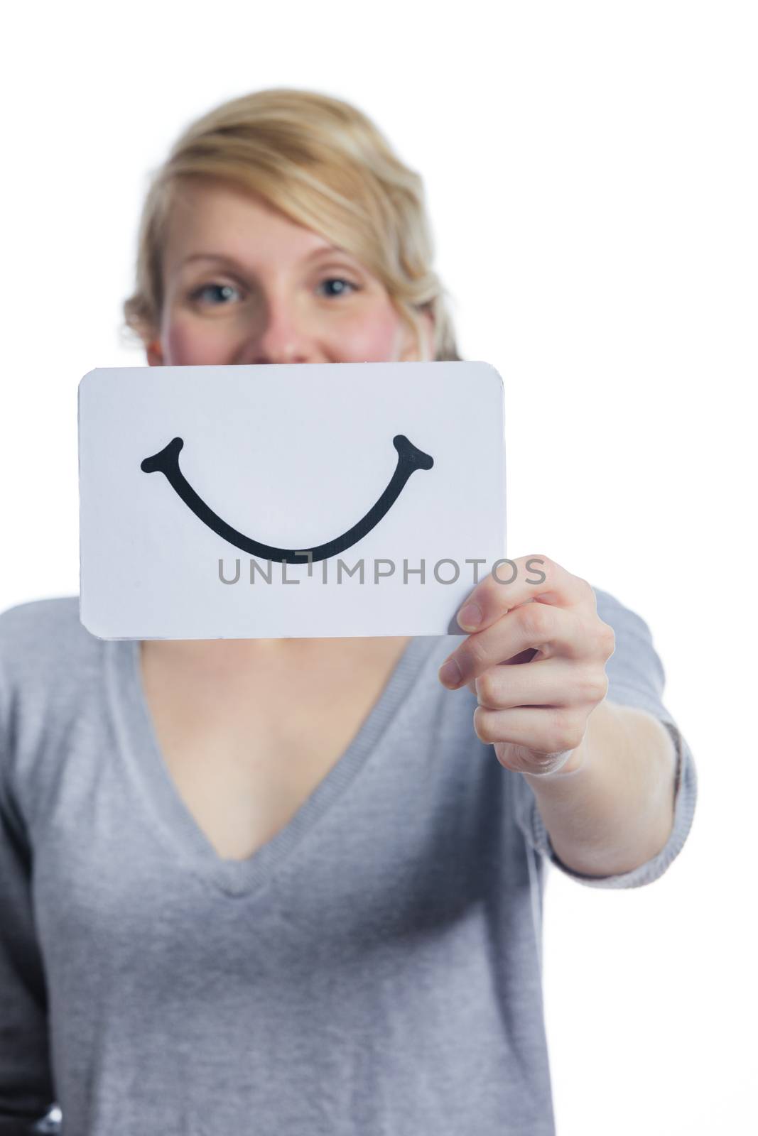 Happy Portrait of a Woman Holding a Smiling Mood Board Isolated on White Background