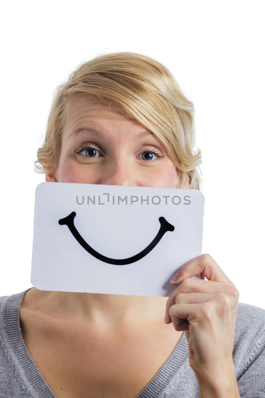 Happy Portrait of a Woman Holding a Smiling Mood Board Isolated on White Background