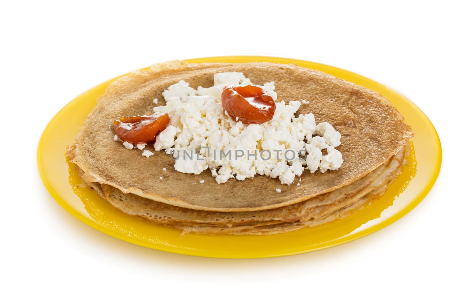 Pancakes with cottage and apricot jam isolated on white background