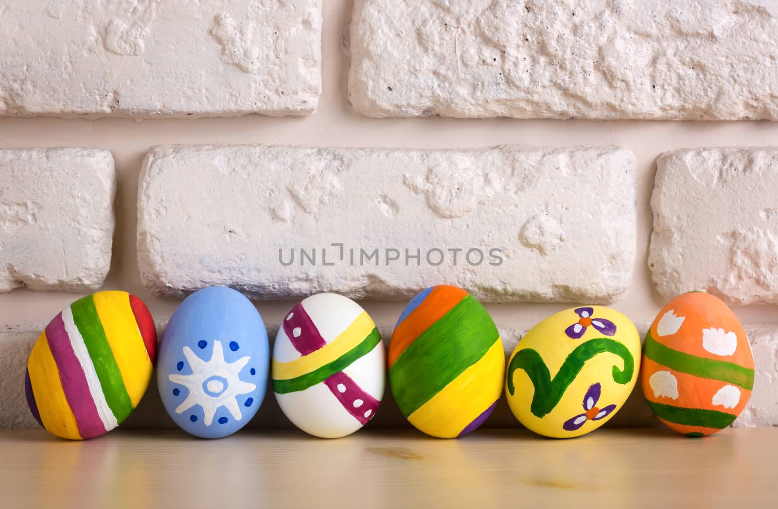 Easter eggs on brick wall background