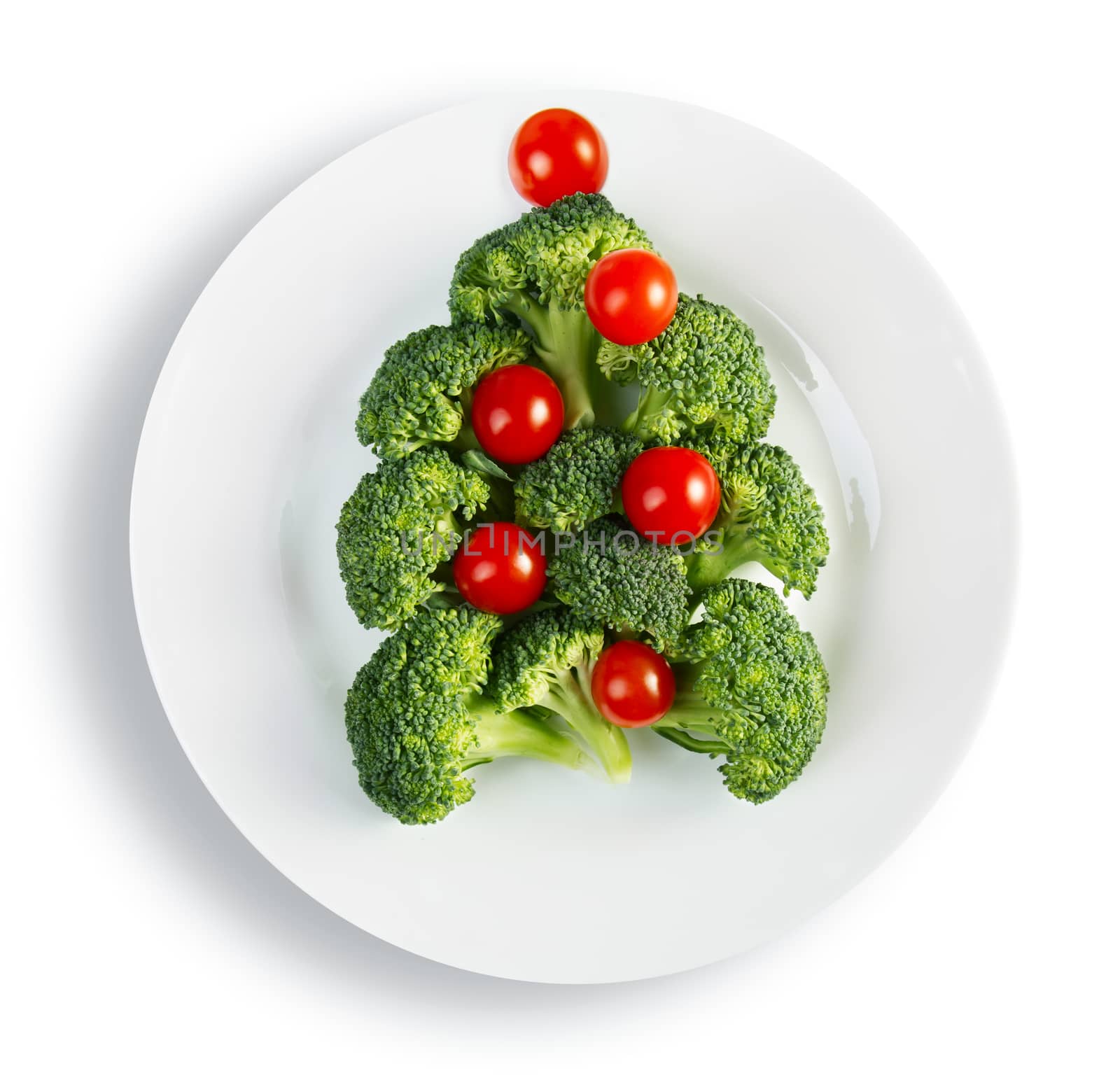 Christmas tree made from broccoli and cherry tomatoes, isolated
