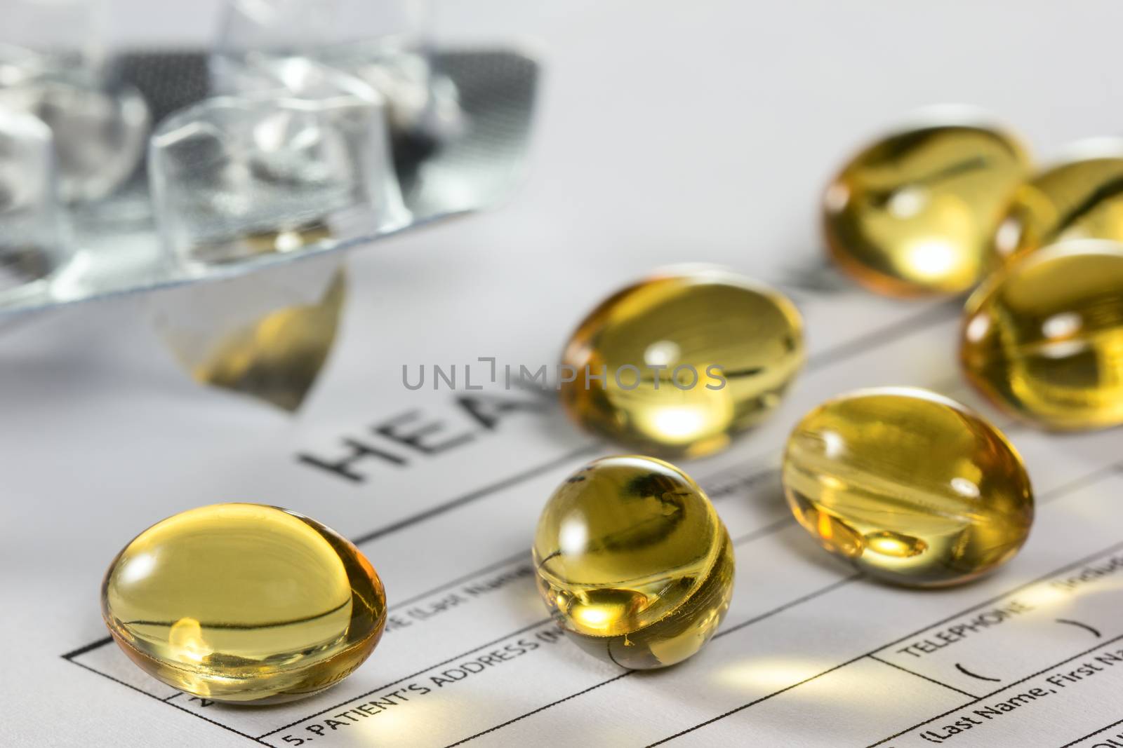 Cod liver oil capsules on health insurance form