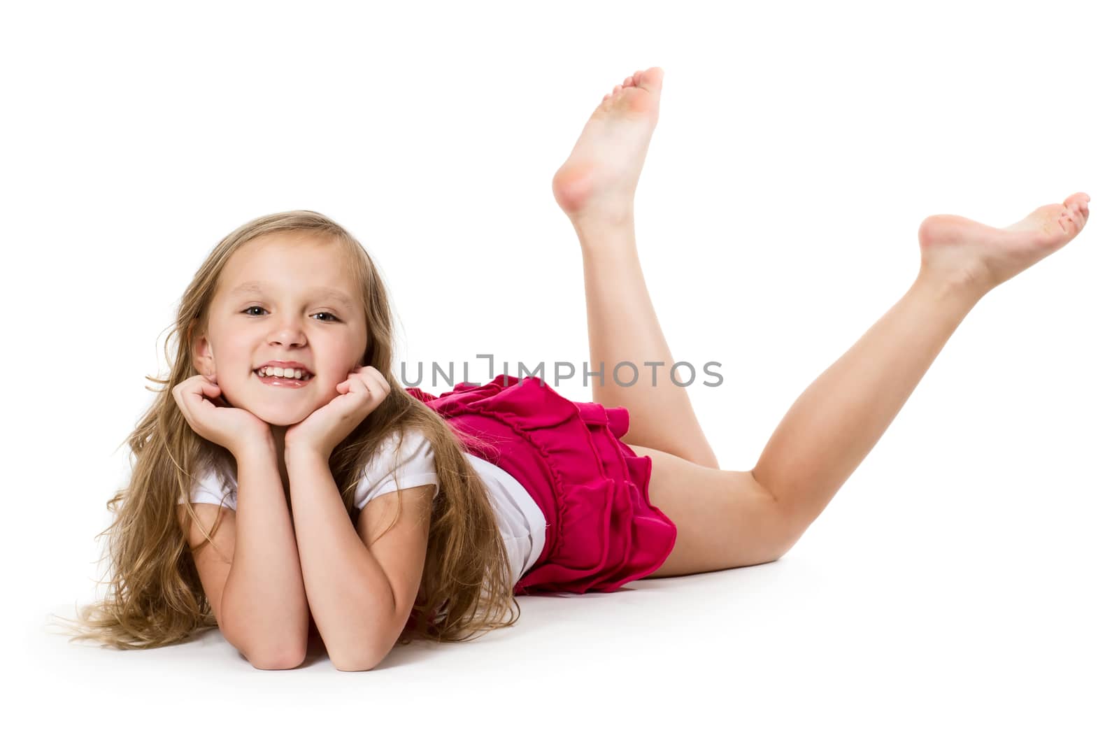 Portrait of a little girl laying on floor, isolated on white background