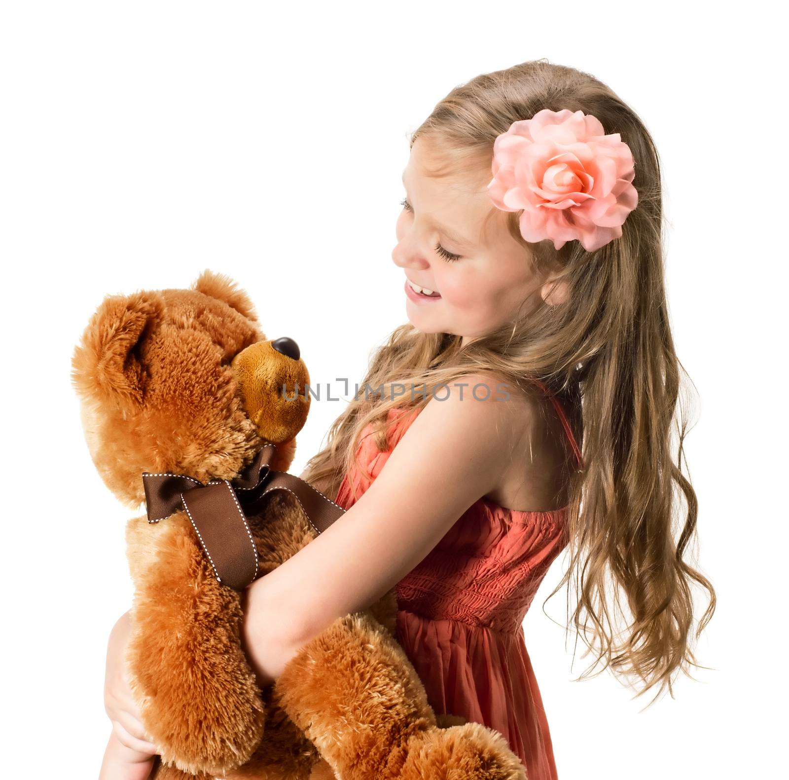 Little girl with teddy bear isolated on white background