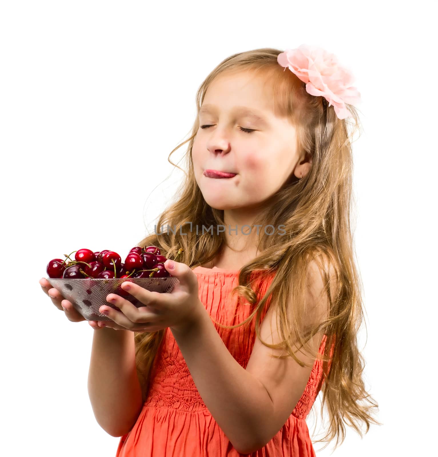 Little girl with cherries isolated on white background