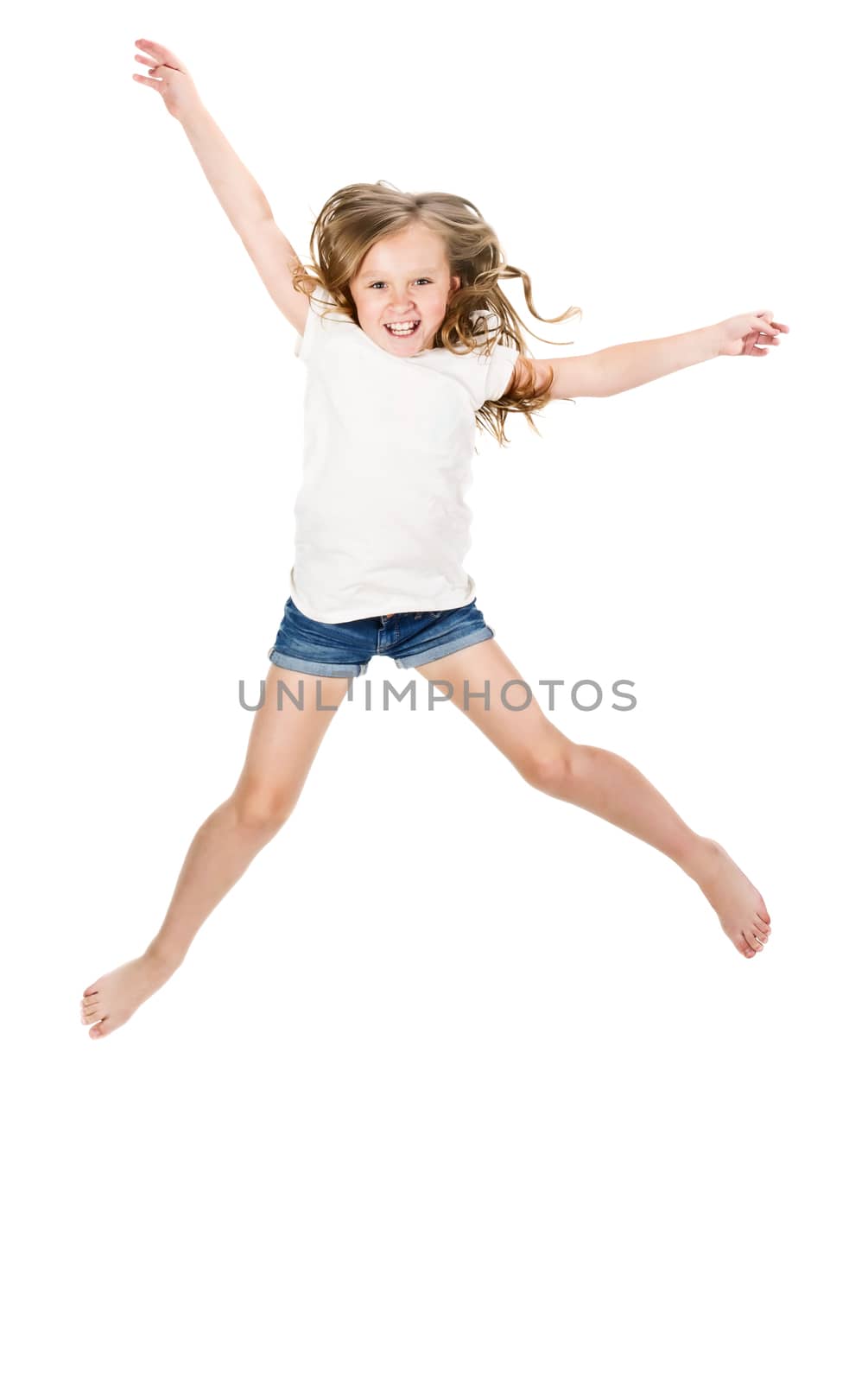 Little girl jumping over a white background 