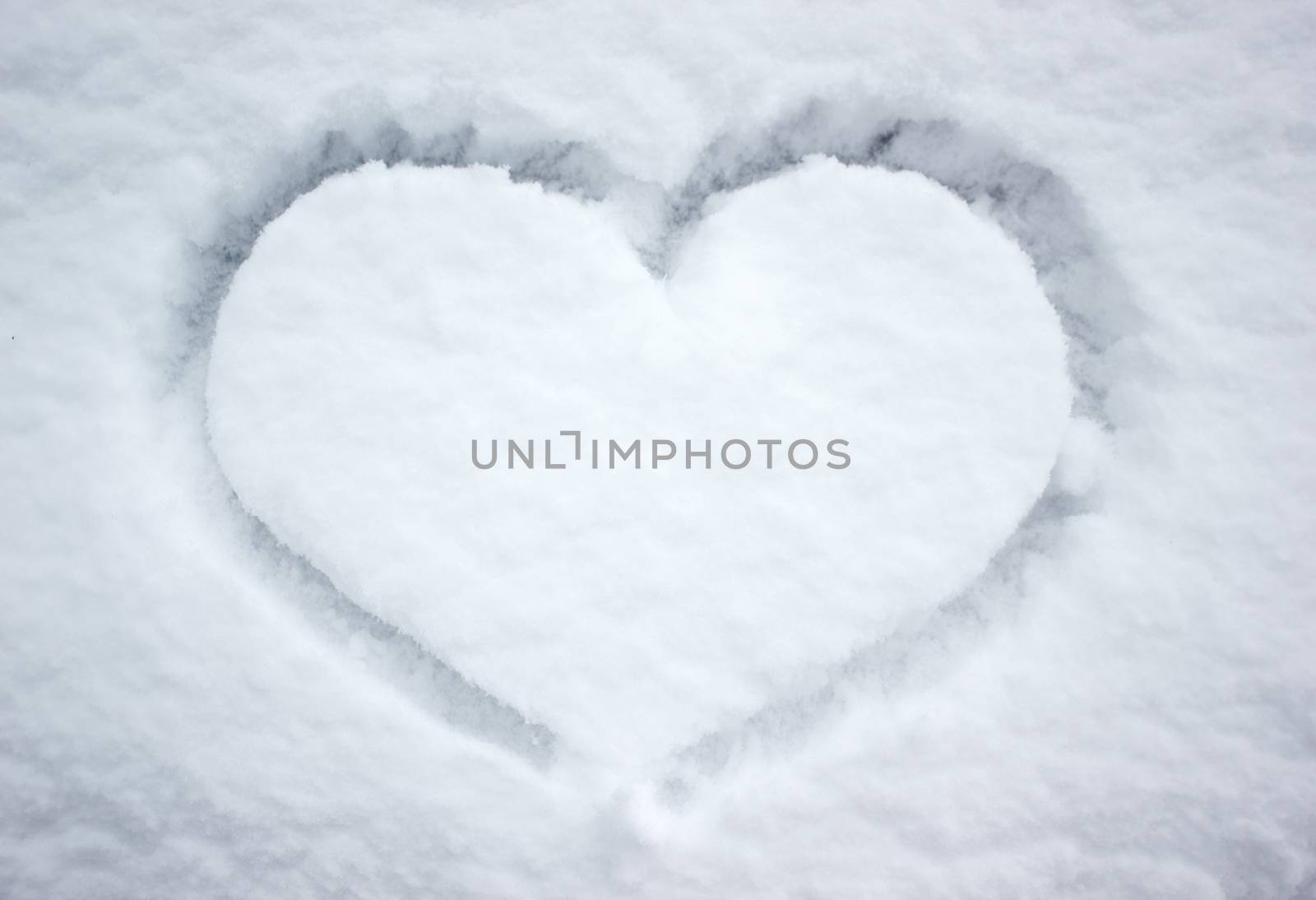 Heart shape in white snow