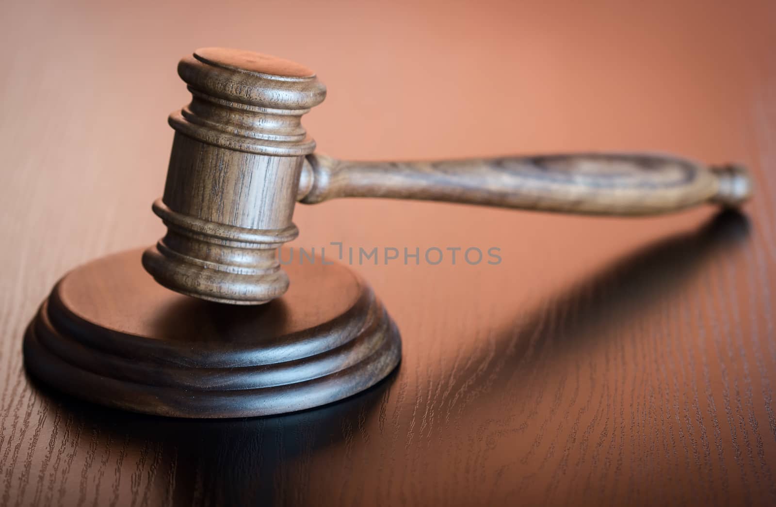 Judge gavel on the brown wooden background