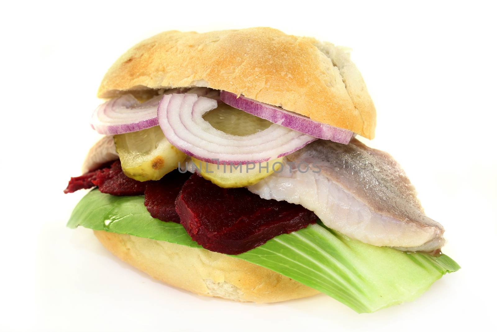 Pickled herring sandwiches with onion, beetroot and pickled cucumber