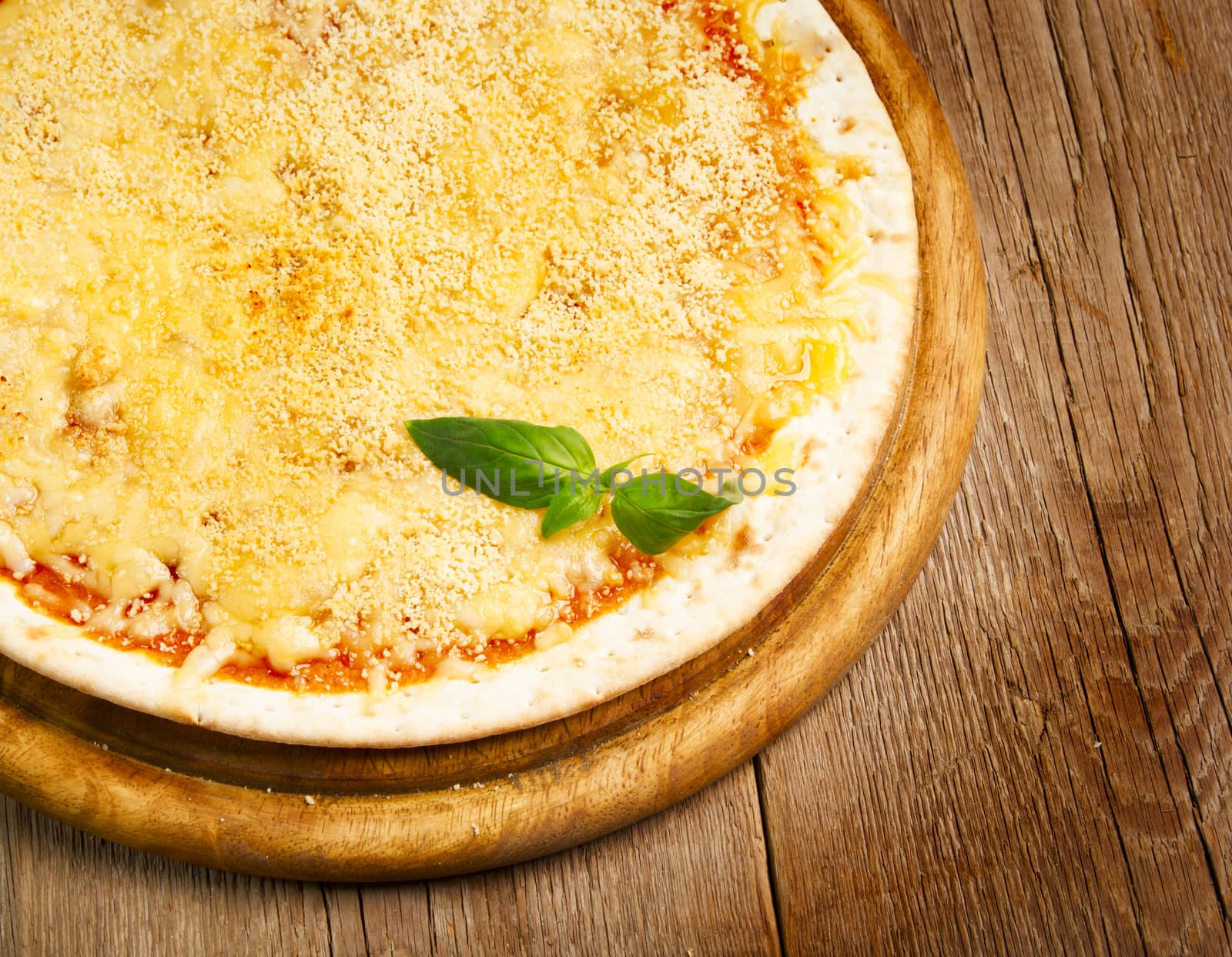 Cheese pizza with basil herb