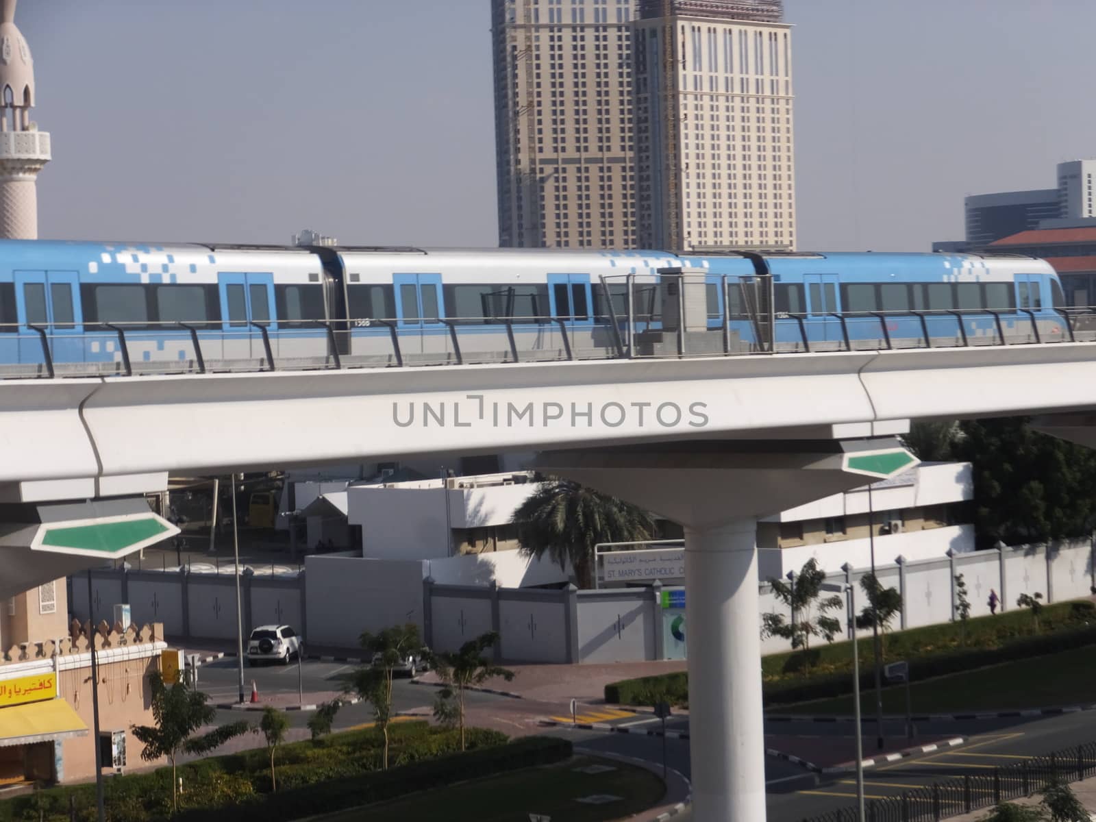Train approaching Oud Metha Metro Station in Dubai, UAE by sainaniritu