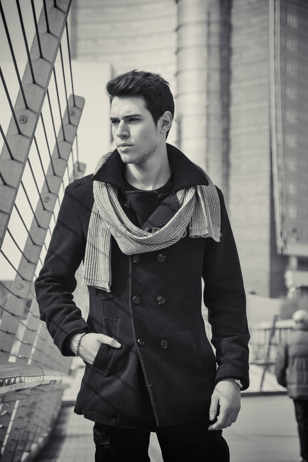 Stylish Young Handsome Man in Black Coat Standing in City Center Street by artofphoto