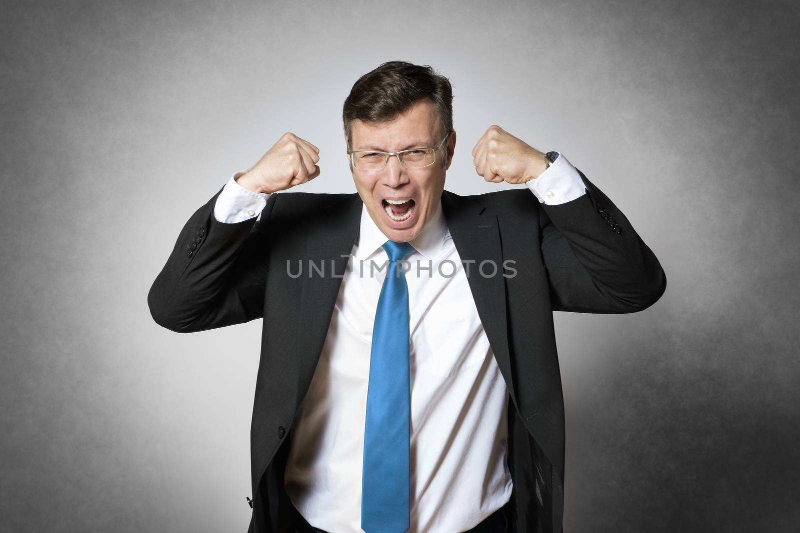 Image of frustrated crying business man in dark suit