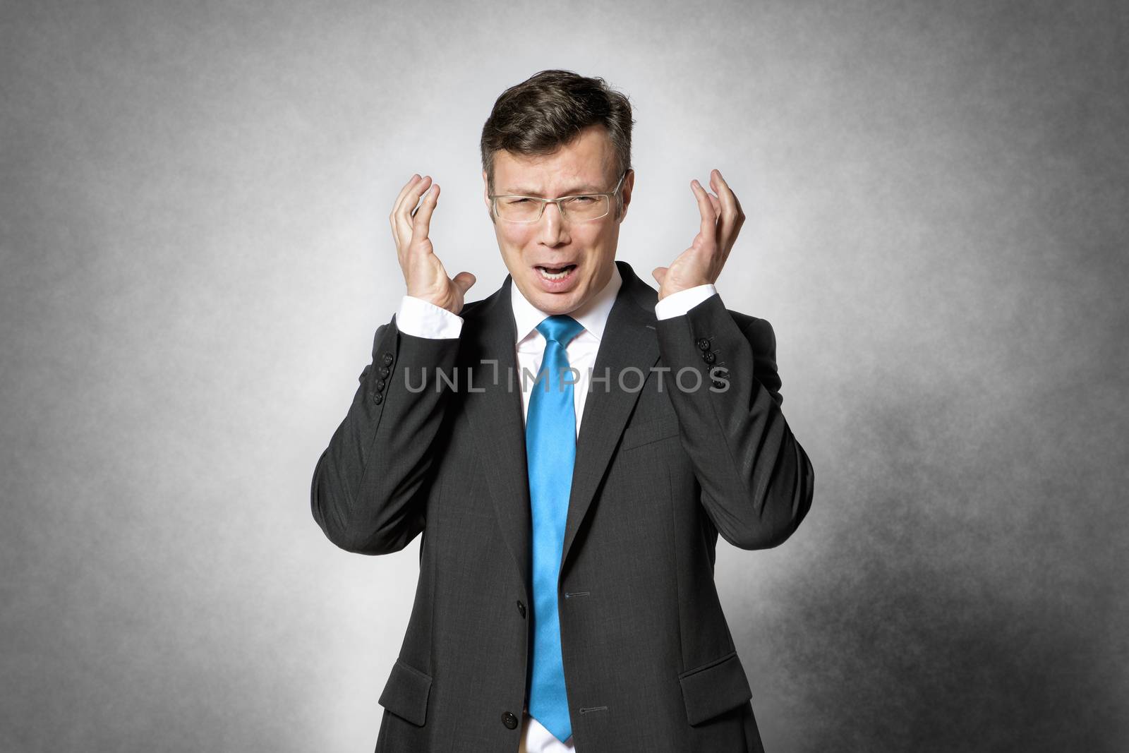 Image of frustrated business man in dark suit