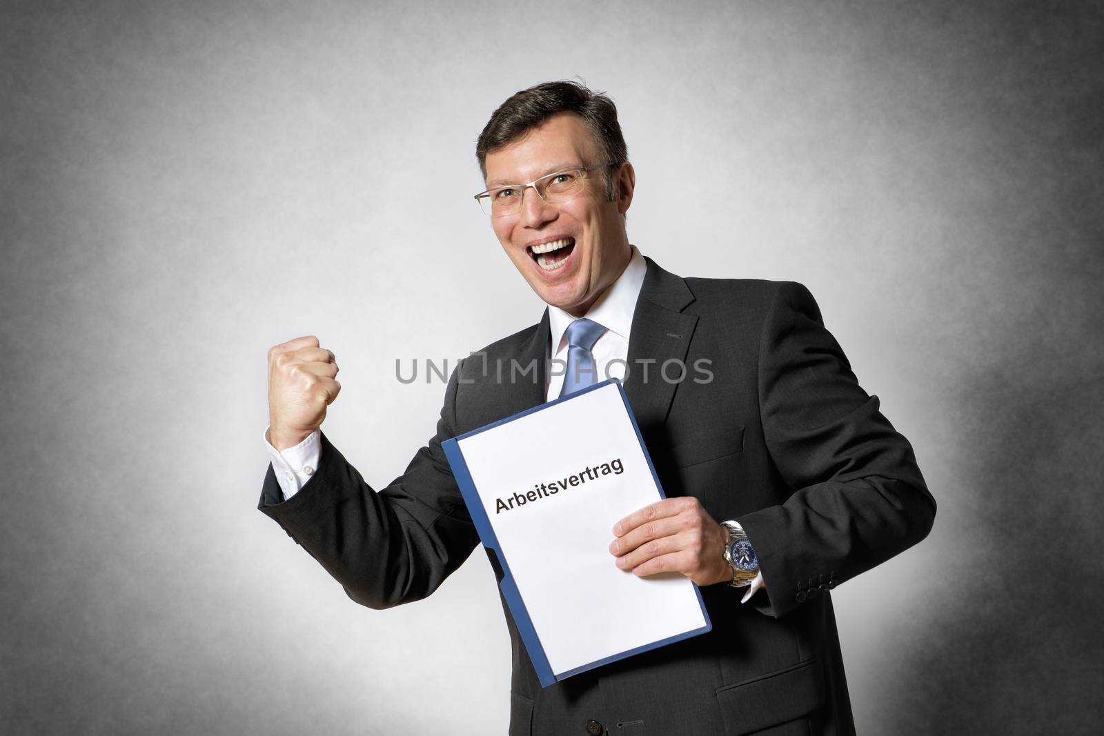 Happy business man with german employment contract