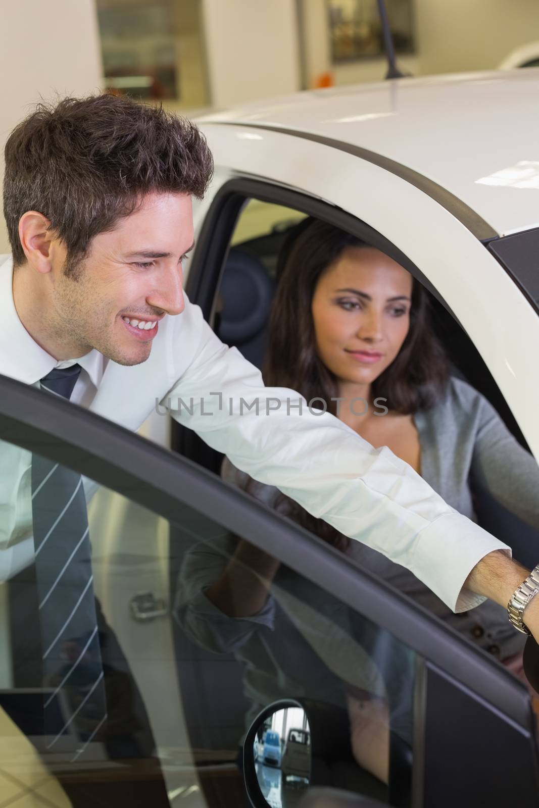 Businessman showing something to his customer by Wavebreakmedia