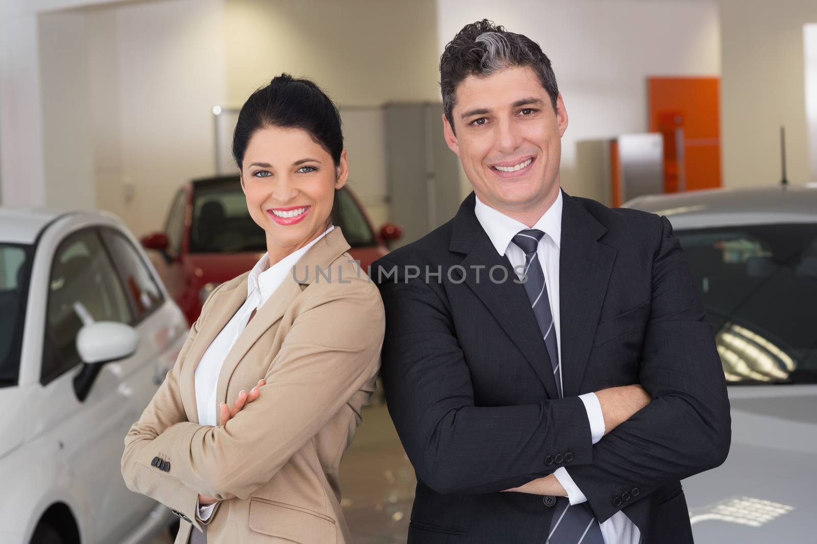 Business team standing with arms crossed by Wavebreakmedia