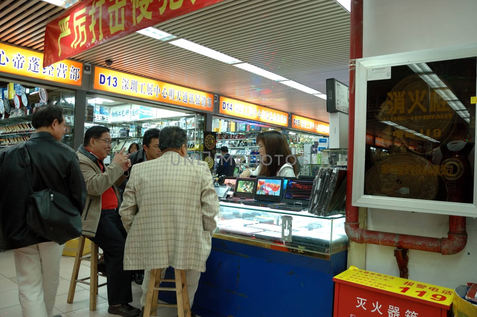 SHENZHEN, CHINA - MARCH 10, 2011: Unidentified salesman and customers inside electronic market on 10th March in Shenzhen, China. 