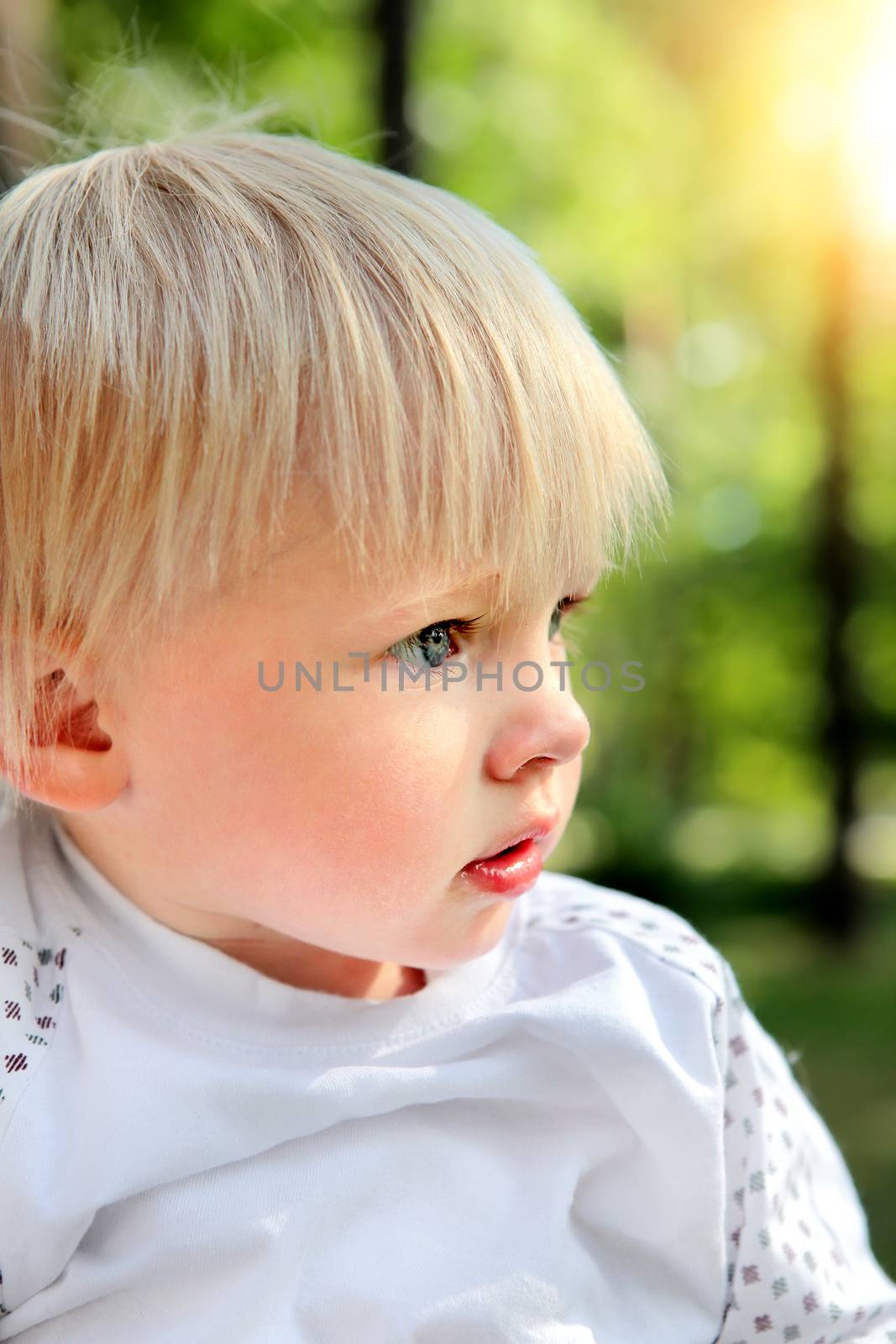 Sad Child Portrait at the Summer Park