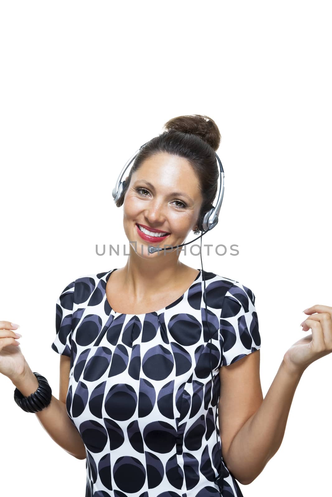 Close up Portrait of Happy Pretty Woman in a Printed Clothing Wearing Headset While Looking at the Camera. Isolated on White.