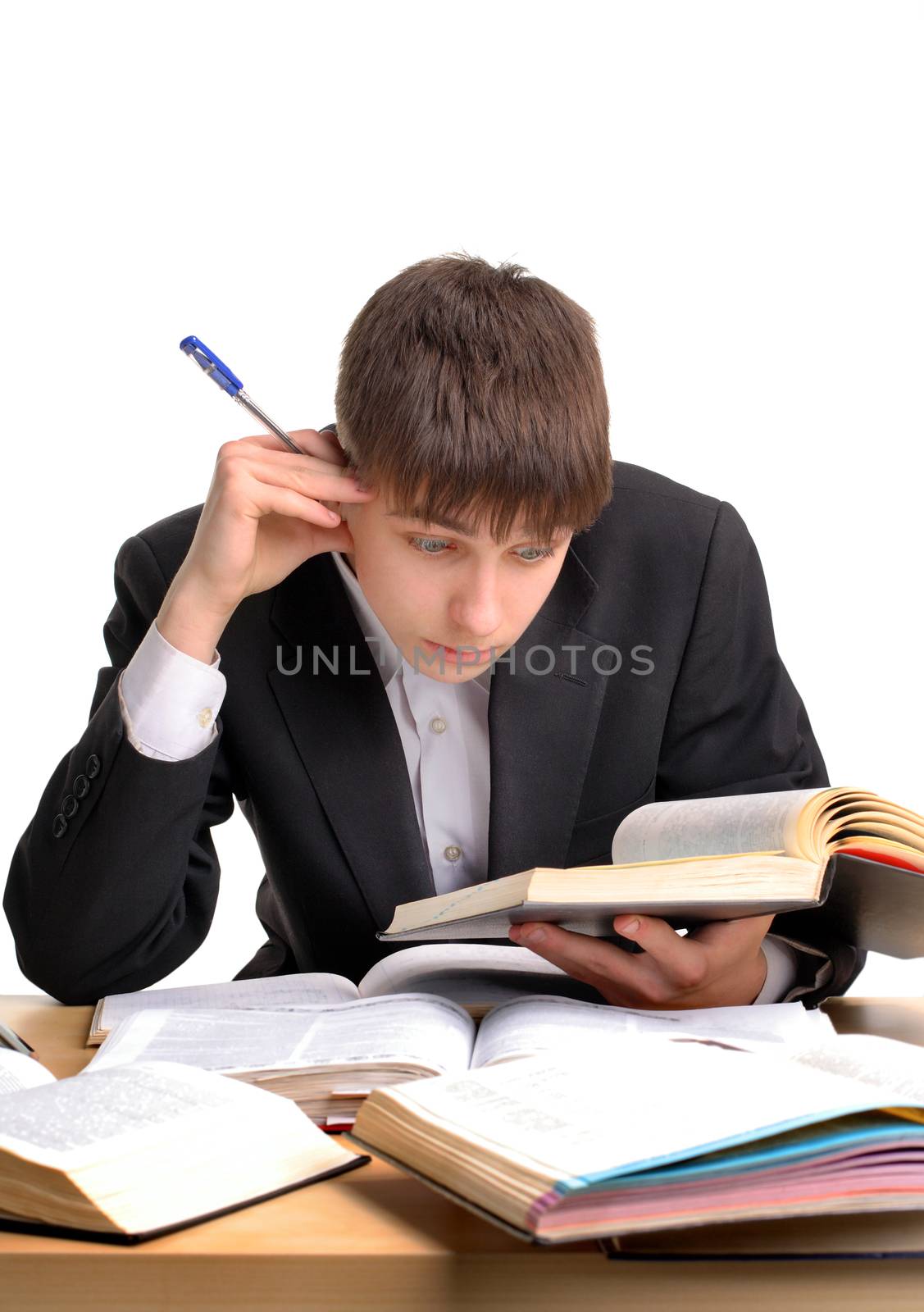 Student reading at the School Desk on the White Background