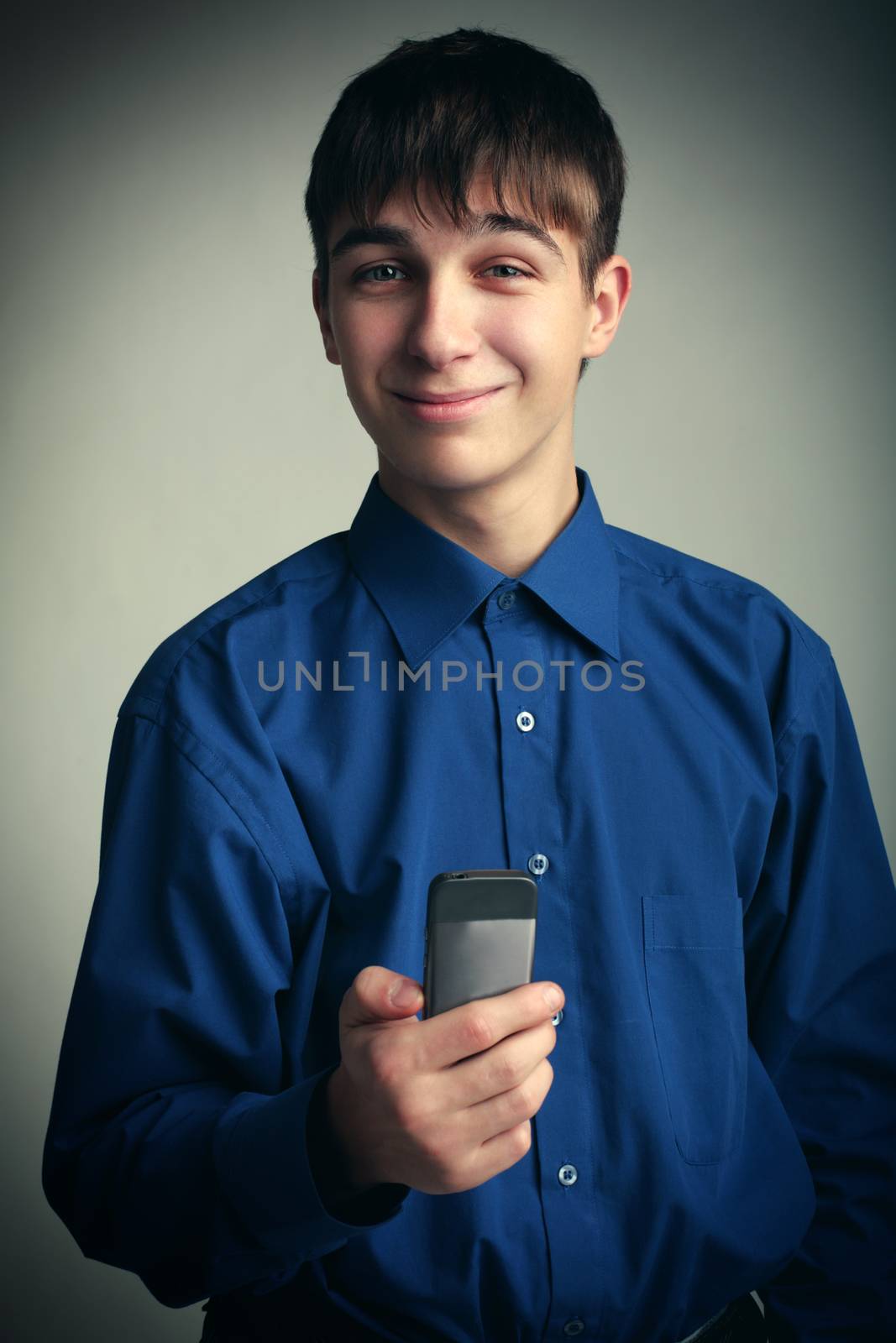 Vignetting Photo of Cheerful Teenager with Cellphone