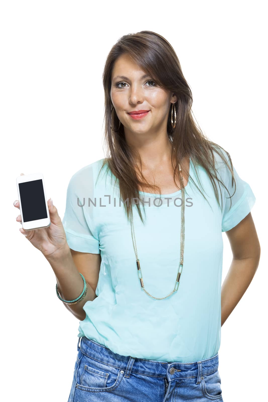 Portrait of Pretty Happy Woman in Casual Clothing Looking Something at her Mobile Phone on Hand. Captures in Studio with White Background.