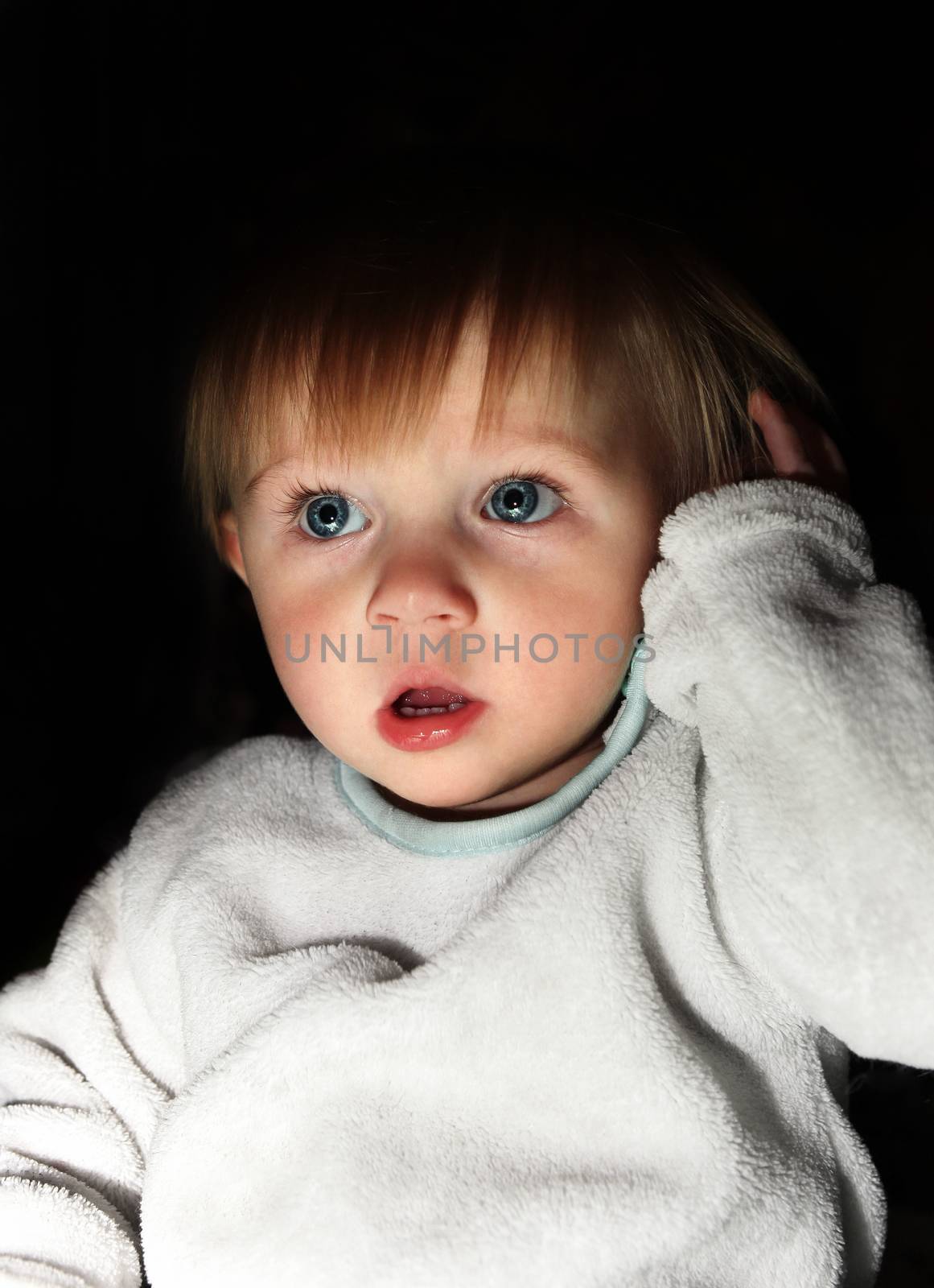 Scared Child Boy Portrait in the Dark Room